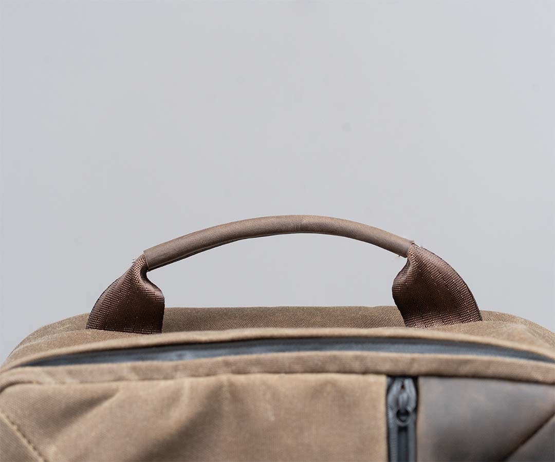 Leather-wrapped top grab handle 
