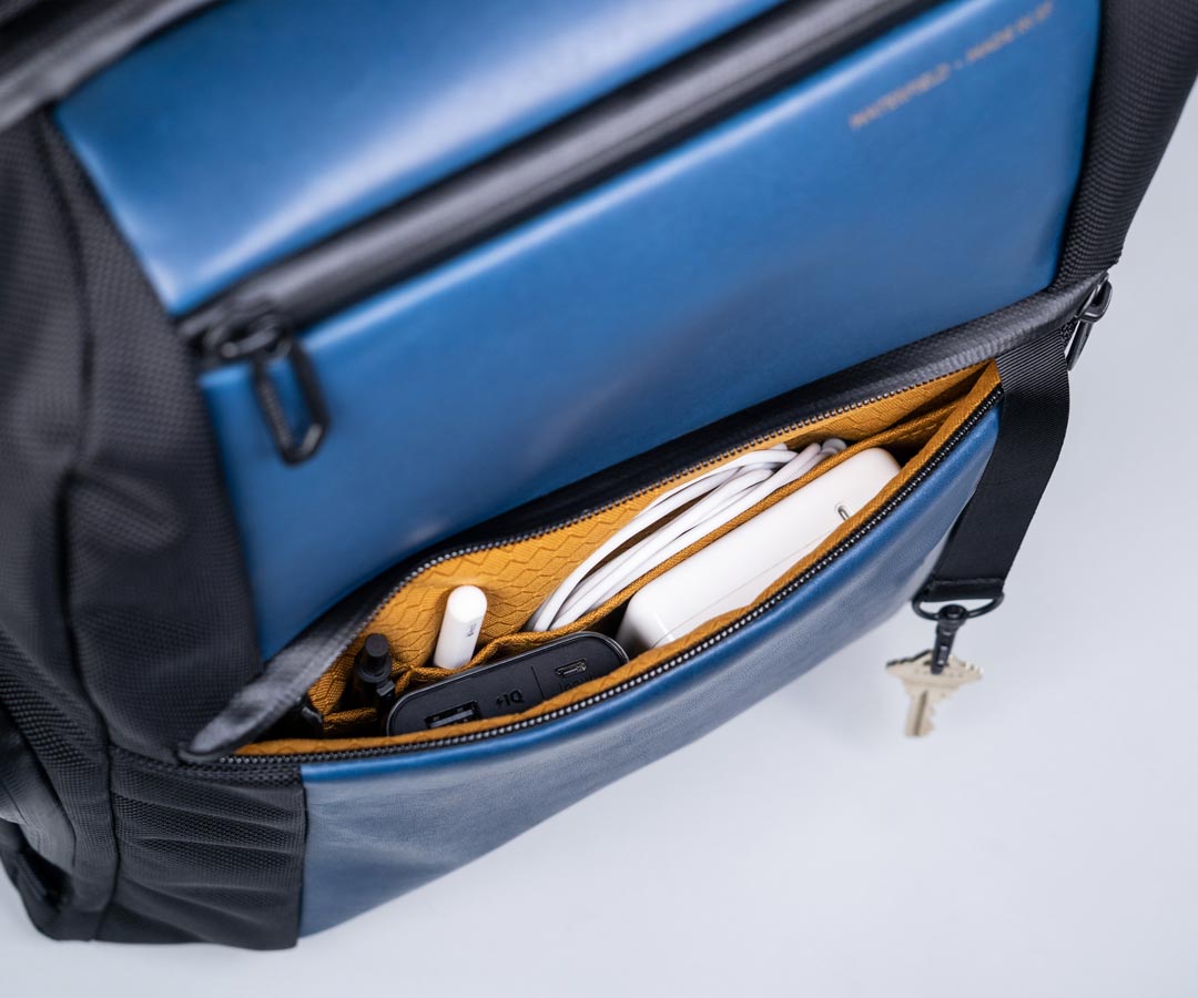 Lower front pocket holds tech gear 