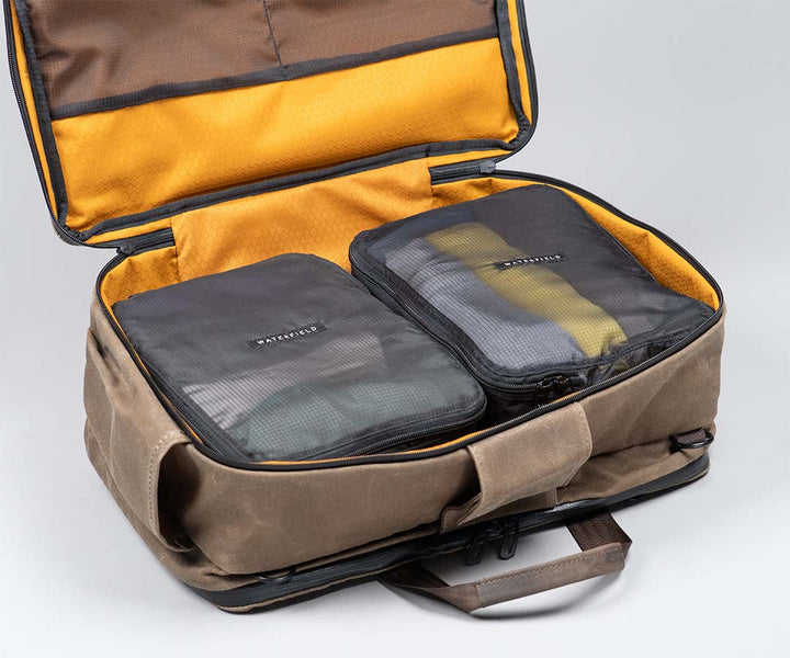 Fits 2 custom-sized Monolite™ Packing Cubes (included)