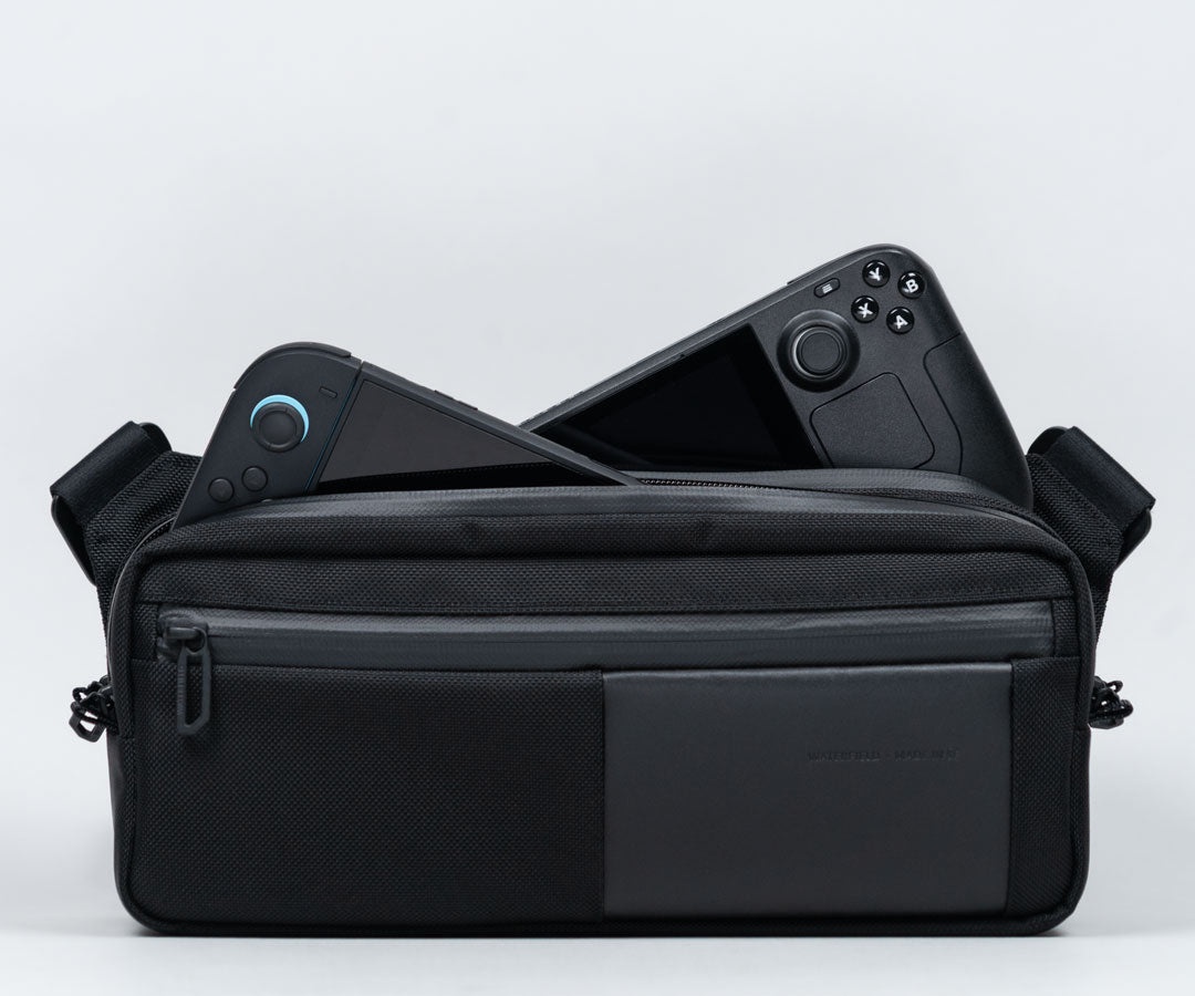 Designed to carry two gaming handhelds