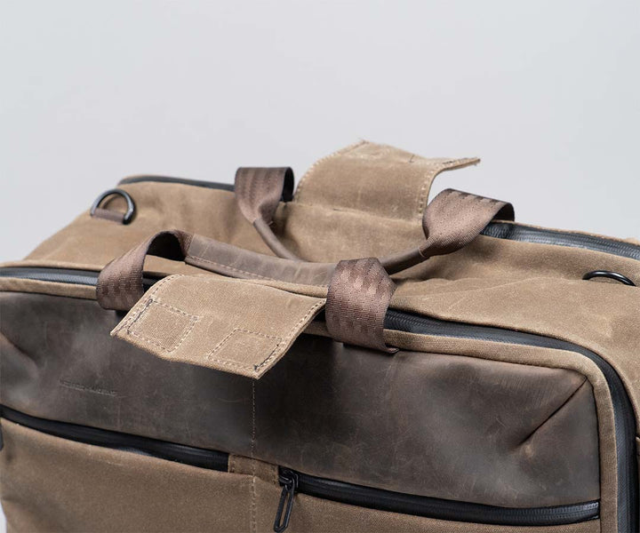 Magnetic flap tucks away side handles