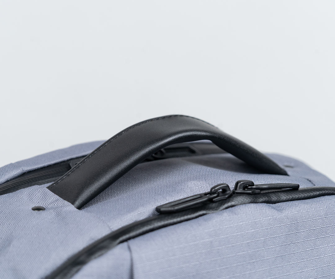 Full-grain leather reinforced grab handle