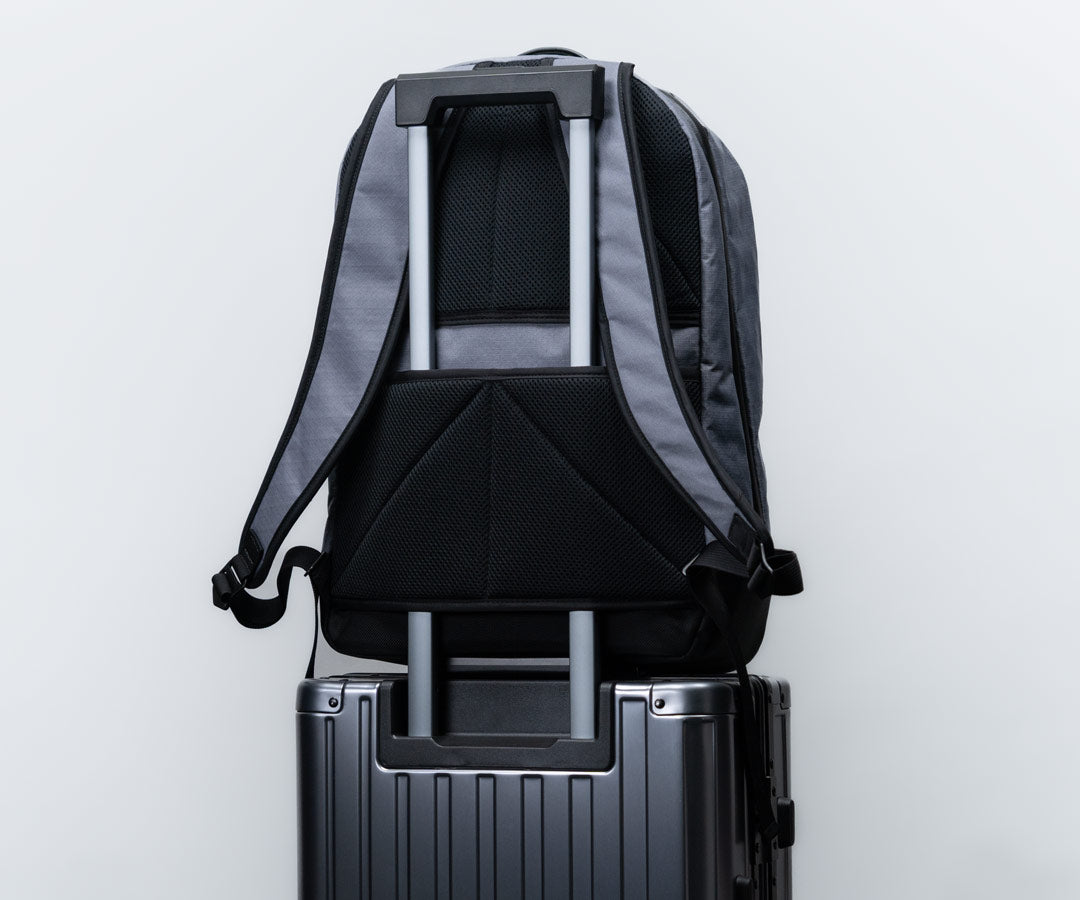 Suitcase handle passthrough slot