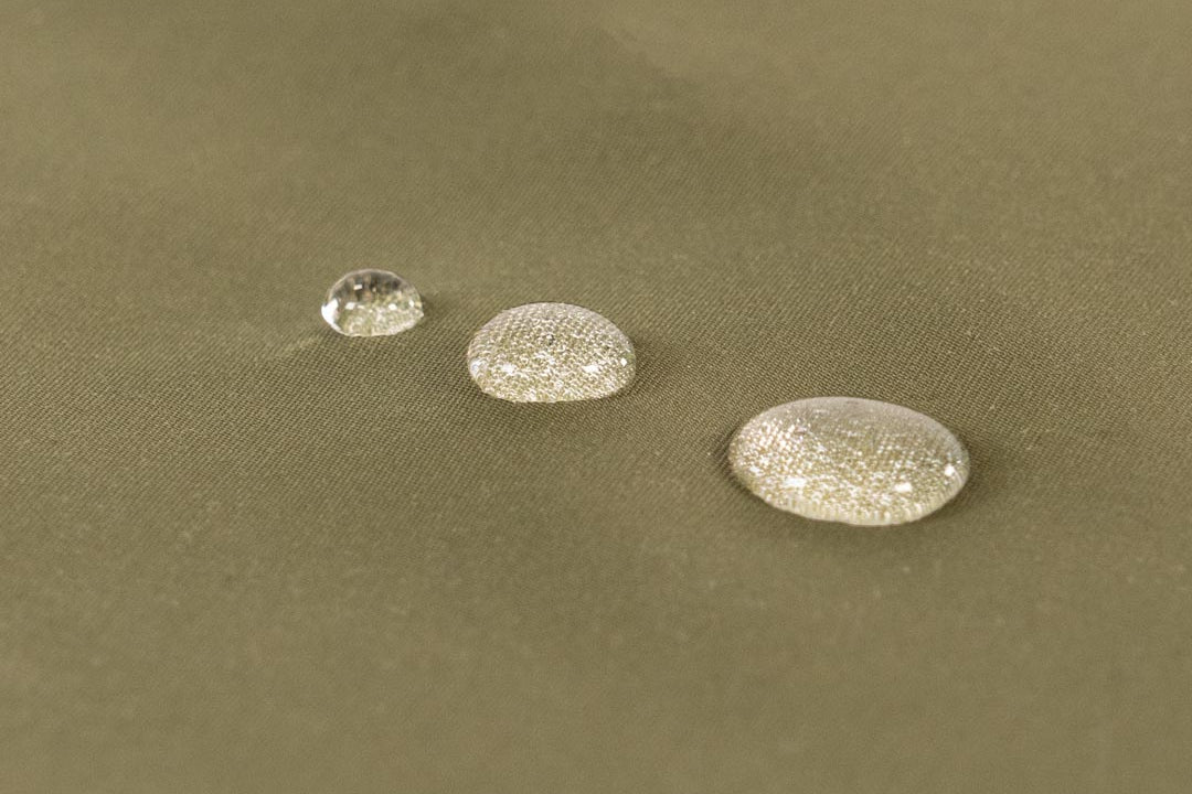 Water-resistant, structured textile with a natural feel